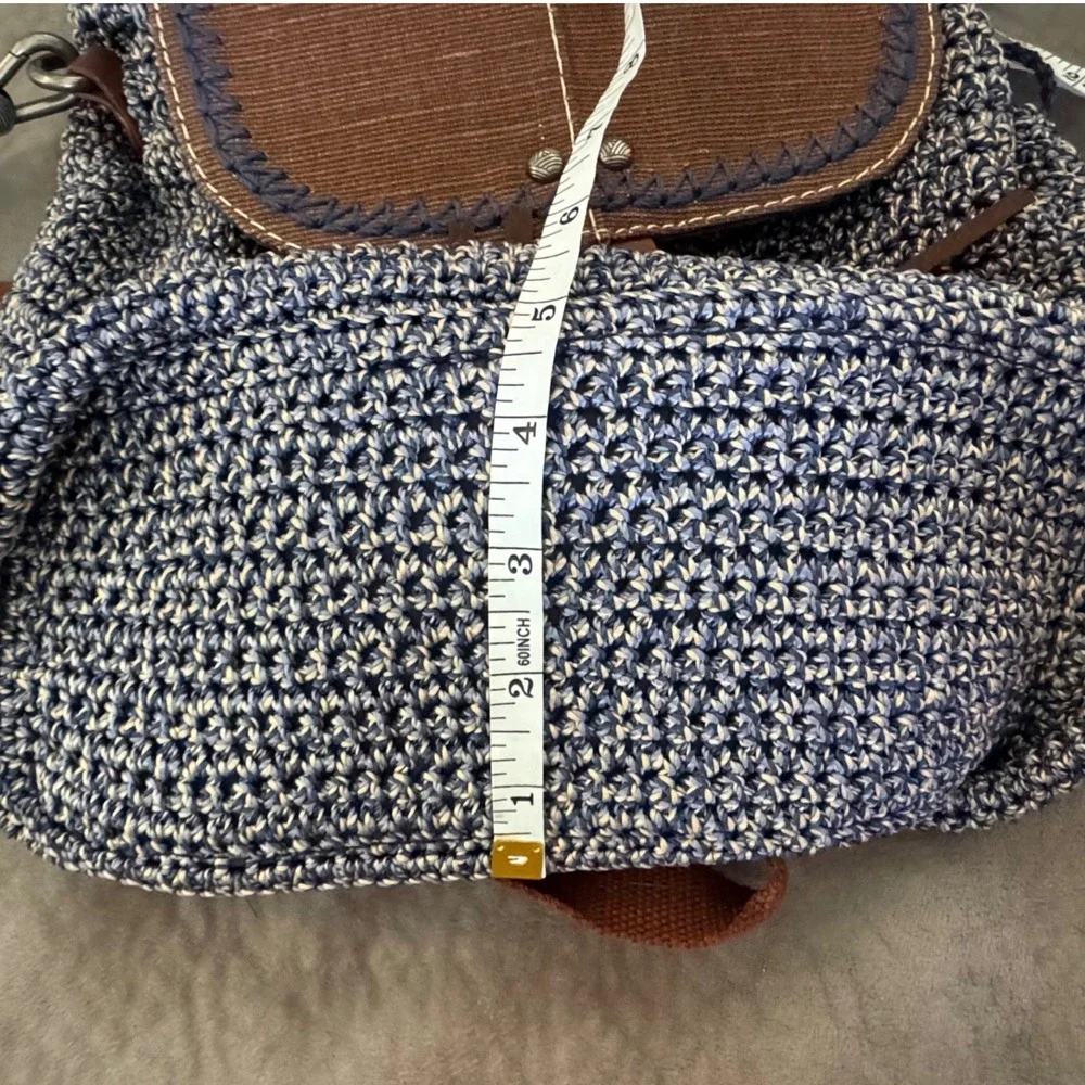 The Sak Brown & Navy Woven Backpack with Tassel Fringe and Embroidered Strap